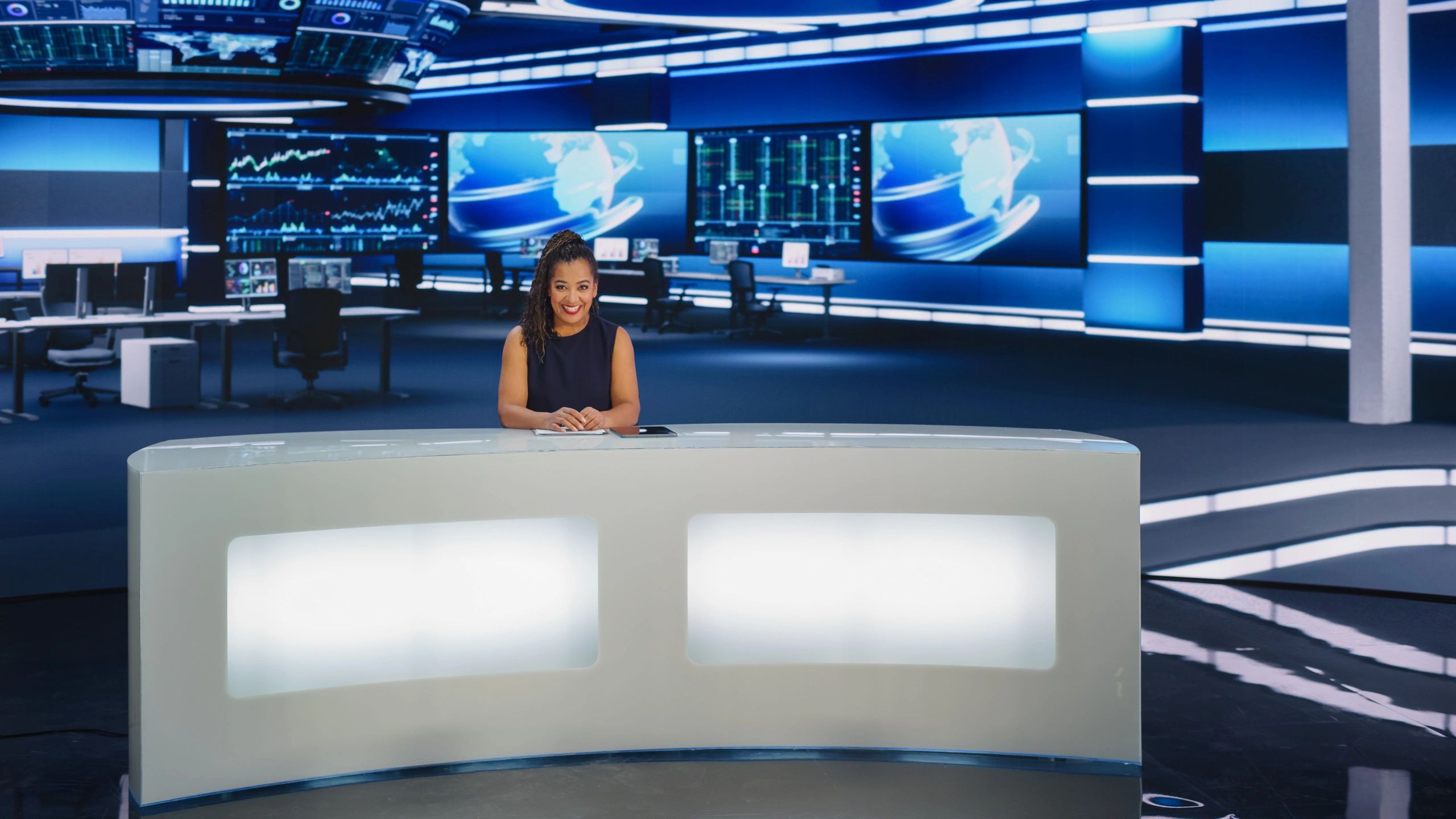 Sports presenter in a modern newsroom studio