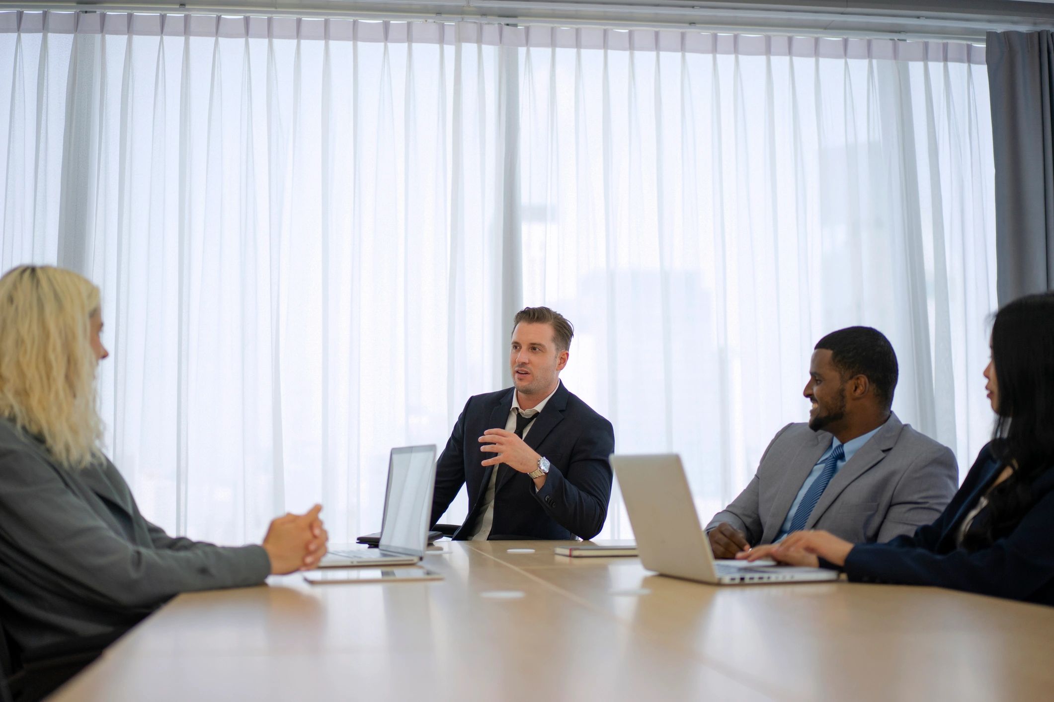 Editorial team meeting around a conference table